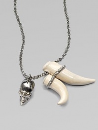 Swarovski crystal accented skull and tusk-shaped pendants on a link chain. BrassSwarovski crystalsLength, about 27Pendant size, about 2 and 1½ Lobster clasp closureMade in Italy