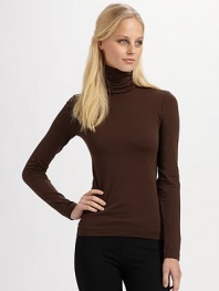 Velvet soft and made in a stretch cotton seamless knit, this pullover is light enough for layering.50% cotton/46% nylon/4% elastene Dry clean Imported