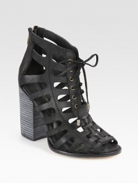 Lace-up leather basic with a downtown attitude, this ankle-grazing design has a chunky stacked heel, edgy cutouts and an exposed back zipper. Stacked heel, 4 (100mm)Leather upperBack zipperLeather lining and solePadded insoleImportedOUR FIT MODEL RECOMMENDS ordering true size. 