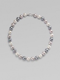 Three gentle tones - grey, nuage and white - come together in a graceful strand of round organic pearls with a sterling silver clasp. 12mm round man-made multicolor pearls Length, about 17 Sterling silver spring clip clasp Made in Spain