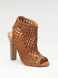 With the rich look of rattan, this striking sandal boot of woven leather has an open toe and back, plus an elastic inset for slip-into ease.Stacked heel, 4½ (115mm) Shaft, 2 Leg circumference, 11 Back elastic inset Leather lining and sole Padded insole ImportedOUR FIT MODEL RECOMMENDS ordering true size. 