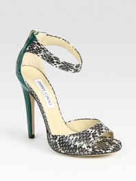 Elegant snakeskin silhouette with a wrap-around ankle strap, contrasting patent leather heel and an exposed back zipper. Patent leather heel, 5 (125mm)Covered platform, ½ (15mm)Compares to a 4½ heel (115mm)Snakeskin and patent leather upperBack zipperLeather lining and solePadded insoleMade in ItalyOUR FIT MODEL RECOMMENDS ordering true size. 