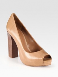 Sleek leather peep toe design with a chunky stacked heel and a gold insert that forms a T. Stacked heel, 4 (100mm)Covered platform, 1 (25mm)Compares to a 3 heel (75mm)Leather upperLeather lining and solePadded insoleImportedOUR FIT MODEL RECOMMENDS ordering one half size up as this style runs small. 