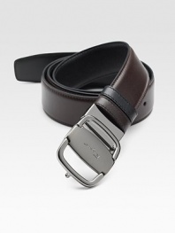Sleek reversible design rendered in Italian leather, finished with an adjustable signature vara buckle.CalfskinRuthenium buckleAbout 1½ wideMade in Italy