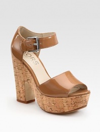 Natural cork heel and platform uplift a supple patent leather upper with an adjustable ankle strap. Cork heel, 5 (125mm)Cork platform, 1½ (40mm)Compares to a 3½ heel (90mm)Patent leather upperLeather lining and solePadded insoleImported