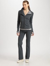 An essential track jacket gets a chic update with a crossover silhouette in soft and stretchy moisture-wicking jersey.Crossover mockneck collarZip-front closureSide zip pocketsLong sleeves with thumb and finger holesAbout 24 from shoulder to hem88% nylon/12% Lycra® spandexMachine washImported Model shown is 5'10 (177cm) wearing US size Small.