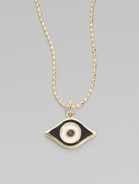 This protective evil eye, strung from a 14k yellow gold chain, is richly punctuated by a black diamond. Diamond, 0.2 tcw Enamel 14k yellow gold Chain length, about 16 Pendant width, about ½ Claw clasp Made in USA 