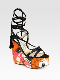 Vibrant, floral-print wedge with leather straps and braided suede laces that make their way up the ankle, concluding with tassels. Self-covered wedge, 5 (125mm)Covered platform, 2 (50mm)Compares to a 3 heel (75mm)Leather and suede upperLeather lining and solePadded insoleMade in ItalyOUR FIT MODEL RECOMMENDS ordering true size. 