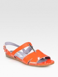 Ideal for goddess-like dresses or flirty jumpsuits, this gleaming patent leather flat has metallic leather trim and an adjustable ankle strap. Patent leather upperLeather lining and solePadded insoleImportedOUR FIT MODEL RECOMMENDS ordering true whole size; ½ sizes should order the next whole size up. 