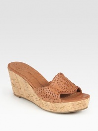 Earthy cork wedge and platform graced by a supple leather upper with embroidery-like stitching. Cork wedge, 2½ (65mm)Cork platform, 1 (25mm)Compares to a 1½ heel (40mm)Leather upperLeather liningRubber solePadded insoleImportedOUR FIT MODEL RECOMMENDS ordering true size. 