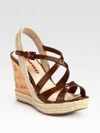 Leather criss-cross design with an espadrille slingback and cork wedge. Cork and hemp wedge, 4 (100mm)Cork and hemp platform, 1 (25mm)Compares to a 3 heel (75mm)Leather and hemp upperLeather liningRubber solePadded insoleImported