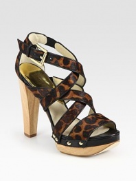 Natural wooden heel topped with small studs and leather trim, this leopard-print calf hair design exudes animal magnetism. Wooden heel, 4½ (115mm)Island platform, 1 (25mm)Compares to a 3½ heel (90mm)Leopard-print calf hair and leather upperLeather lining and solePadded insoleImported