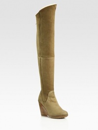 Thigh-high suede wedge design with an exposed back zipper and contoured shaft. Stacked wedge, 4 (100mm)Covered platform, ½(15mm)Compares to a 3½ heel (90mm)Shaft, 24Leg circumference, 15Suede upperBack zipperShearling liningRubber solePadded insoleMade in Italy