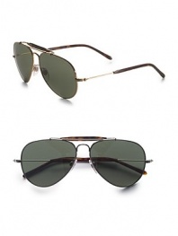 A timeless aviator style in lightweight metal, crafted with a traditional double bridge detail. Available in gold frames with green lenses or silver frames with silver mirror lenses. UV400 lens Made in Italy 