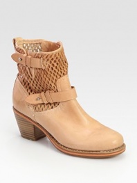 Perforated leather moto design with adjustable wrap-around buckles and a chunky stacked heel. Stacked heel, 2½ (65mm)Leather upperPull-on styleLeather lining and soleRubber solePadded insoleImportedOUR FIT MODEL RECOMMENDS ordering true size. 