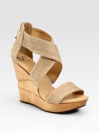 Wide burlap criss-cross straps and an exposed back zipper enhance this architectural wooden wedge. Wooden wedge, 4½ (115mm)Wooden platform, 1 (25mm)Compares to a 3½ heel (90mm)Burlap upperBack zipperLeather liningRubber solePadded insoleImportedOUR FIT MODEL RECOMMENDS ordering true size. 