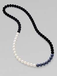 From the Night Blue Collection. This high contrast piece features a strand of flocked velvet beads accented with white and black pearlized glass beads. Length, about 34½ Slip-on style Imported 