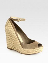 Elaborate espadrille wedge complemented by a soft suede upper and an adjustable ankle strap. Hemp wedge, 4½ (115mm)Hemp platform, 1 (25mm)Compares to a 3½ heel (90mm)Suede upperLinen liningRubber solePadded insoleImportedOUR FIT MODEL RECOMMENDS ordering one half size up as this style runs small. 