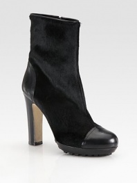 Elaborate calf hair and leather style with an exposed side zipper and rubber sole for extra traction. Stacked heel, 4 (100mm)Covered platform, 1½ (40mm)Compares to a 2½ heel (65mm)Calf hair and leather upperSide zipperGenuine dyed lamb fur liningRubber and leather solePadded insoleMade in Italy