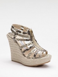 Ultra exotic, this strappy style in snake-printed metallic leather zips up the front and perches atop an espadrille platform wedge.Rope-covered wedge, 4¾ (120mm) Covered platform, 1½ (40mm) Compares to a 3¼ heel (80mm) Leather upper Front zipper Leather lining Padded insole Rubber sole Made in ItalyOUR FIT MODEL RECOMMENDS ordering true whole size; ½ sizes should order the next whole size up. 