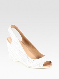 Woven slingback design in soft Italian leather with a substantial wedge and peep toe. Self-covered wedge, 3½ (90mm)Leather upperLeather liningRubber solePadded insoleImportedOUR FIT MODEL RECOMMENDS ordering one half size up as this style runs small. 