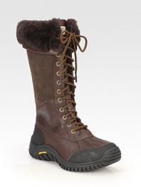 Tall rustic leather and suede design with a lace-up front, shearling cuff and sporty rubber sole for added traction. Rubber heel, 1 (25mm)Shaft, 13Leg circumference, 17Leather and suede upperShearling liningRubber solePadded insoleImported