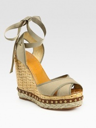 Secured by a grosgrain ribbon tie, this woven straw wedge has a canvas upper, hemp platform and studded leather trim. Straw wedge, 5 (125mm)Studded leather and hemp platform, 1½ (40mm)Compares to a 3½ heel (90mm)Canvas upperLeather lining and soleMade in SpainOUR FIT MODEL RECOMMENDS ordering true whole size; ½ sizes should order the next whole size up. 