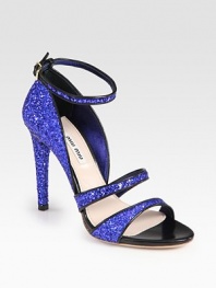 Glittered leather silhouette with smooth leather trim and an adjustable ankle strap. Glittered leather heel, 4 (100mm)Glittered leather upperLeather lining and solePadded insoleMade in ItalyOUR FIT MODEL RECOMMENDS ordering one size up as this style runs small. 