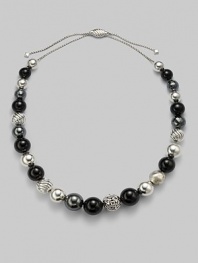 From the David Yurman Elements Collection. A single row of sterling silver, black onyx and hematite beads with a unique sliding closure.Black onyx Hematite Sterling silver Length, about 16 Sliding closure Imported 