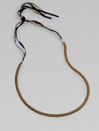 A fine herringbone chain with a gilded grosgrain ribbon tie.Brass Grosgrain ribbon Adjustable ties About 25½ long Imported