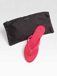 Rubber slip-on with logo detail and matching nylon cosmetic bag.Rubber sole ImportedOUR FIT MODEL RECOMMENDS ordering true whole size; ½ sizes should order the next whole size up. 