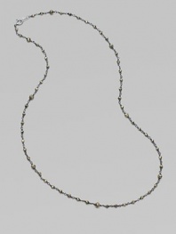 A long, elegant chain of oxidized sterling silver is richly dotted with rough pyrite beads.Pyrite Oxidized sterling silver Length, about 18 Spring ring clasp Made in USA