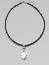 A carved sterling silver pendant drops from a finely braided leather necklace. From the Classic Chain Collection Sterling silver Leather Necklace, about 18 long Imported