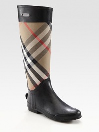 Classic canvas check print rain boot, finished with jersey lining and an exposed back zipper. Shaft, 15Leg circumference, 16Canvas and rubber upperExposed back zipperJersey liningRubber solePadded insoleImportedOUR FIT MODEL RECOMMENDS ordering true whole size; ½ sizes should order the next whole size up. 