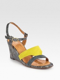 Textured, snake-embossed leather wedge features colorblocked suede straps and an adjustable slingback. Snake-embossed leather-covered wedge, 3 (75mm)Suede and embossed leather upperLeather lining and solePadded insoleMade in SpainOUR FIT MODEL RECOMMENDS ordering one size up as this style runs small. 