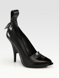 High-fashion leather style with an extended pull tab and a unique peep toe with a built-in toe ring and sculpted heel. Self-covered heel, 4Leather upperLeather lining and solePadded insoleImported