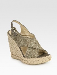 Textured, slightly distressed straw upper with an adjustable leather slingback strap and woven rope wedge. Stacked rope wedge, 5 (125mm)Rope platform, 1 (25mm)Compares to a 4 heel (100mm)Straw and leather upperLeather liningBuffed leather solePadded insoleImported