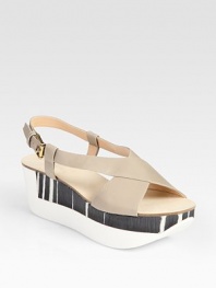 Two-tone, mixed-media platform wedge design accented by supple leather criss-cross straps. Rubber and wooden wedge, 2 (50mm)Rubber and wooden platform, 1½ (40mm)Compares to a ½ heel (15mm)Leather upperLeather liningRubber soleMade in Italy
