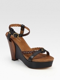 Braided straps cross smooth leather, concluding with an architectural wedge and adjustable ankle strap. Leather and wooden wedge, 4½ (115mm)Covered platform, 1 (25mm)Compares to a 3½ heel (90mm)Leather upperLeather lining and solePadded insoleMade in Italy