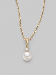 Simple and lovely, a white, round cultured Akoya pearl has a sparkling diamond accent, plus a chain and setting of 18k gold. 6mm white round cultured pearl Quality: A+ Diamond, 0.03 tcw 18k yellow gold Length, about 18 Spring ring clasp Imported