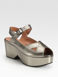 French metallic leather silhouette with a slight cutout wedge and an adjustable ankle strap. Self-covered wedge, 3 (75mm)Island platform, 1½ heel (40mm)Compares to a 1½ heel (40mm)Metallic leather upperLeather liningRubber solePadded insoleMade in Francebr>OUR FIT MODEL RECOMMENDS ordering true size. 