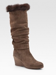 Slightly slouched, weatherproof suede style topped off with a plush rabbit fur trim. Crepe wedge, 3 (75mm) Shaft, 14½ Leg circumference, 15 Rabbit fur cuff Weatherproof suede upper Faux fur lining Rubber sole Padded insole ImportedOUR FIT MODEL RECOMMENDS ordering one half size up as this style runs small. 