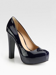 Sultry patent leather platform with an ultra-high heel. Self-covered heel, 5 (125mm)Covered platform, 1 (25mm)Compares to a 4 heel (100mm)Patent leather upperLeather liningRubber solePadded insoleImported