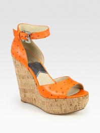 Rustic cork wedge topped with an ostrich-print leather upper and adjustable ankle strap. Cork wedge, 5 (125mm)Cork platform, 1½ (40mm)Compares to a 3½ heel (90mm)Ostrich-print leather upperLeather lining and solePadded insoleImported