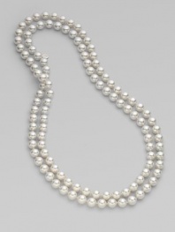 An extra long strand of round, iridescent pearls that can be worn wrapped around the neck for a classic style statement.White, organic man-made pearls Length, about 48 Made in Spain 