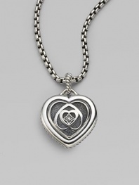 From the Cable Heart Collection. This exquisite cutout heart of fine sterling silver features the iconic logo at its center. Sterling silver Width, about 1 Imported 