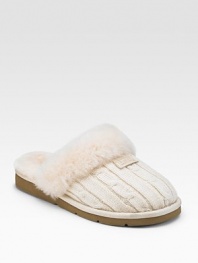 Warm and comfy wool design with shearling lining. Wool knit upper Shearling lining Padded insole Rubber sole ImportedOUR FIT MODEL RECOMMENDS ordering true whole size; ½ sizes should order the next whole size up. 