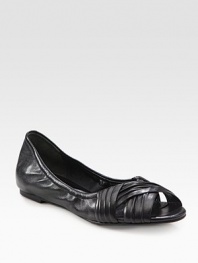 Ruched leather flat with a stretchy upper and unique peep toe. Leather upperLeather liningRubber solePadded insoleImportedOUR FIT MODEL RECOMMENDS ordering one half size down as this style runs large. 