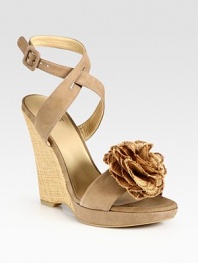 Adjustable, soft leather straps and an artful flower adornment add ladylike vibes to this timeless straw wedge. Straw wedge, 4 (100mm)Covered platform, ½ (15mm)Compares to a 3½ heel (90mm)Suede and straw upperLeather lining and solePadded insoleMade in SpainOUR FIT MODEL RECOMMENDS ordering true size. 