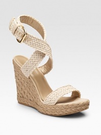 A crocheted ankle-strap design with leather details and roped, rural-inspired wedge.Roped wedge heel, 4¾ (120mm) Roped platform, 1¼ (30mm) Compares to a 3½ heel (90mm) Open toe Adjustable strap with buckle Cotton upper Leather lining Padded insole Rubber sole Made in SpainOUR FIT MODEL RECOMMENDS ordering true size.. 